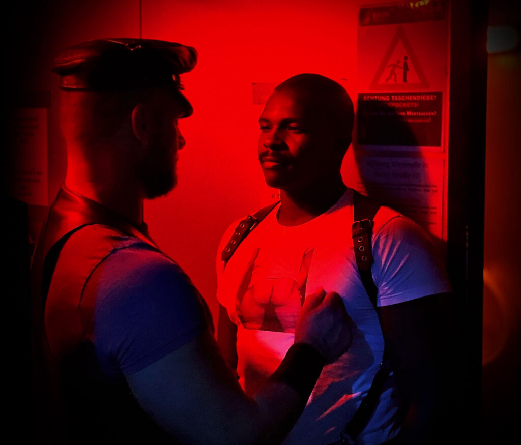 The first approach of two men hoping to engage in consensual sex in a darkroom
